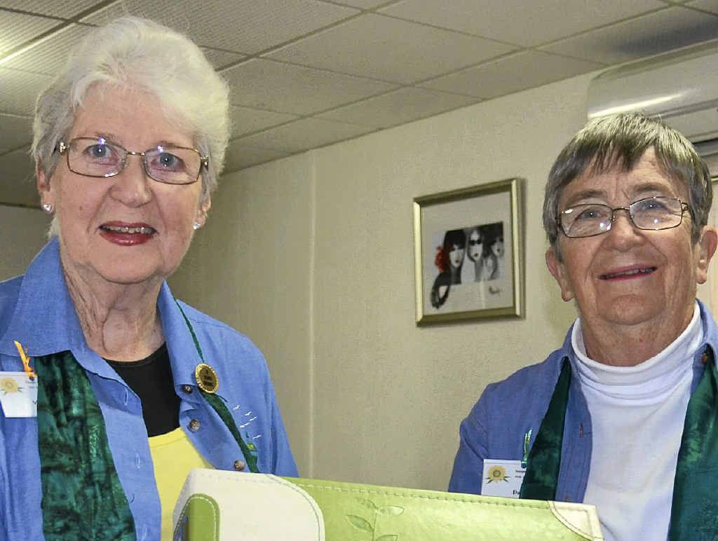 RECORD: Margaret Davey from Wynnum presents national Scope president Daphne Whatley with a scrapbook highlighting the club’s activities over the past year. RECORD: Margaret Davey from Wynnum presents national Scope president Daphne Whatley with a scrapbook highlighting the club’s activities over the past year.